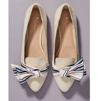 A pair of Alexandra Bow-Tied Flats in white