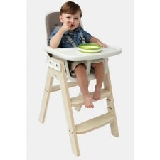 A baby using OXO Tot Sprout High Chair
