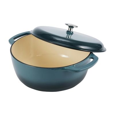 A gray Dutch oven, open to show a cream-colored interior