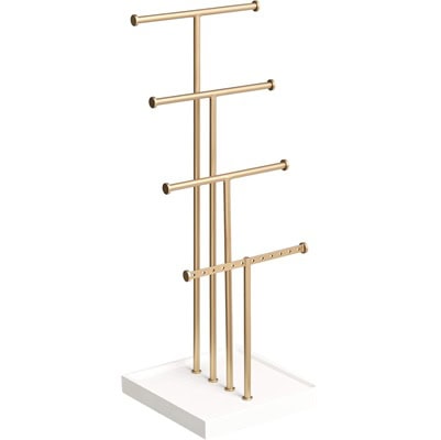 A four-tier gold-tone jewelry organizer with white base