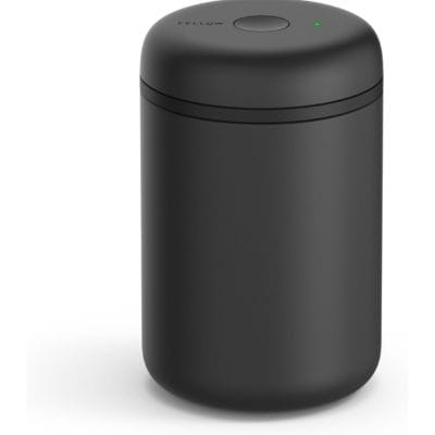 A black cylindrical coffee canister