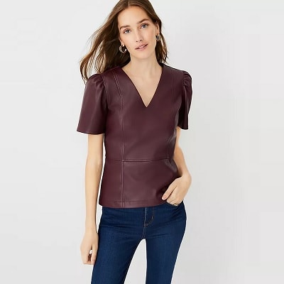V-neck faux leather with puff sleeves and a peplum hem