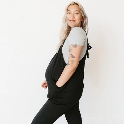 A pregnant l;ady with black jumpsuit