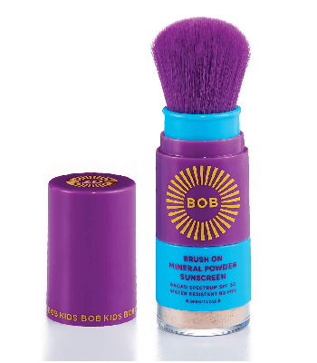 A purple container of powder sunscreen with the brush next to it. BOB Kids Brush-On Mineral Powder Sunscreen
