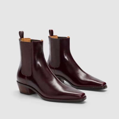 A pair of brown pointed ankle boots