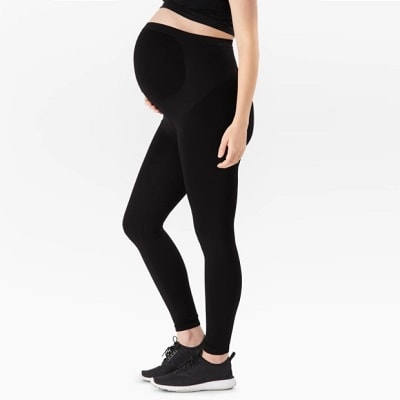 Woman wearing black maternity support leggings