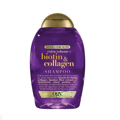 A purple bottle of OGX Biotin & Collagen Extra Strength Volumizing Shampoo