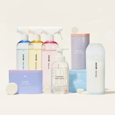 A collection of multicolored bottes/containers of cleaning products 