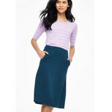 A woman wearing an Audrey Skirt