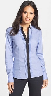 A woman wearing a Rodera Colorblock Pleat Front Shirt