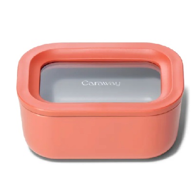 A rectangular glass food container with an orange covering