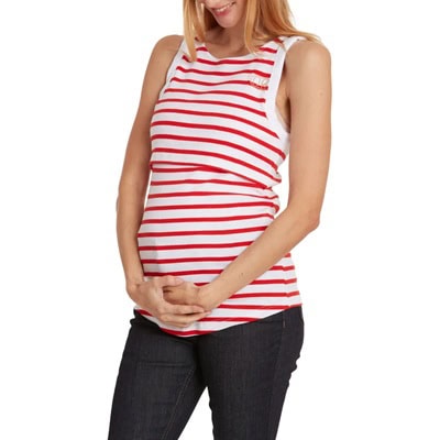 A woman wearing a red-and-white striped maternity tank and black jeans