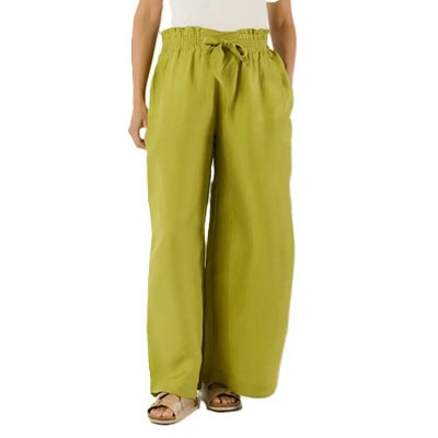 A woman wearing chartreuse maternity pants, white top, and light brown sandals