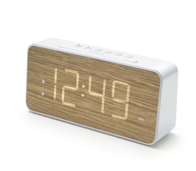 A woodgrain and white alarm clock reading "12:49"