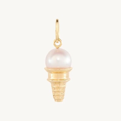 A gold ice cream cone charm with a pearl as the scoop of ice cream