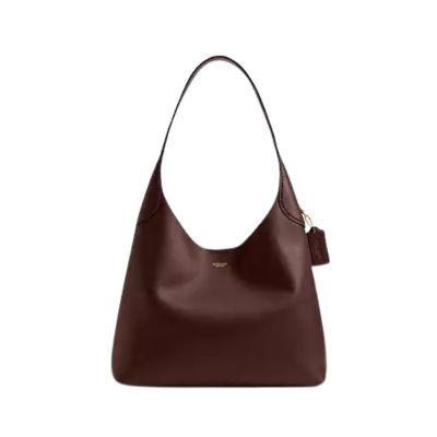 A brown Coach shoulder bag