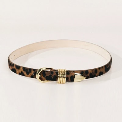 A calf hair belt with gold tone buckle