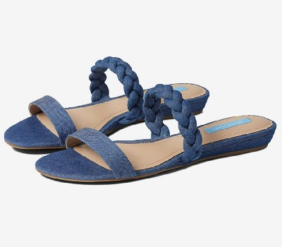 A pair of blue denim sandals with tan insoles