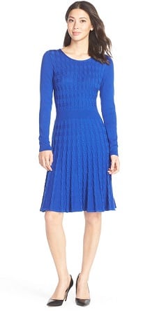 A woman wearing a Cable Knit Fit & Flare Sweater Dress