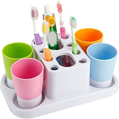 White toothbrush organizer holding cups and brushes