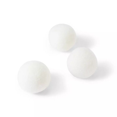 Three white wool dryer balls