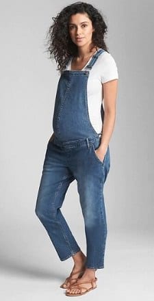 A woman wearing a Maternity Denim Overalls