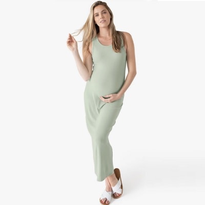 A woman wearing a Gwen Ribbed Bamboo Maternity Midi Dress