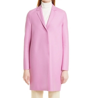 A lady wearing a pink wool coat
