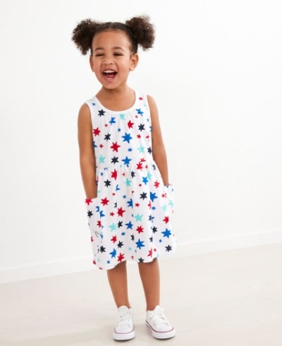 A young girl wearing a star printed Pocket Art Dress