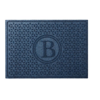 A blue with a printed letter B doormat