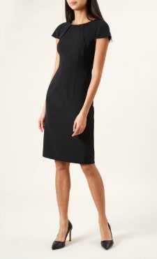 A woman wearing a Cap Sleeve Lynsey Dress