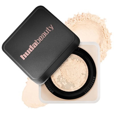A black container of Huda Beauty setting powder