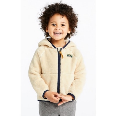A kid wearing a fleece jacket