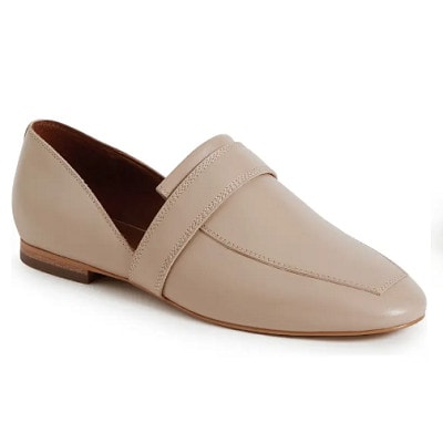 A beige pointed-toe loafer
