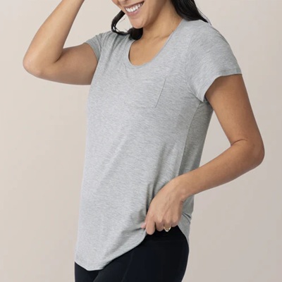 A woman wearing a gray nursing t-shirt and black pants