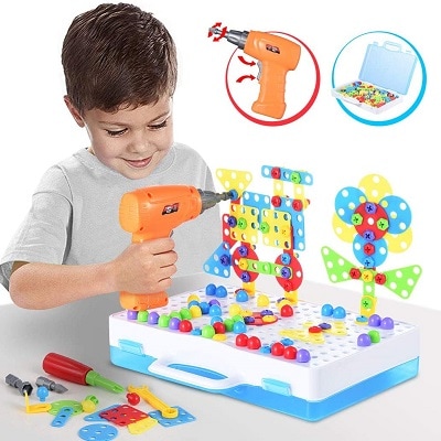 A child playing with a Toy Drill and and Screwdriver Tool Set