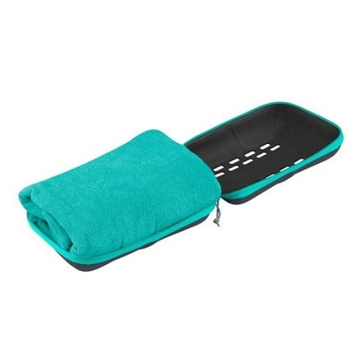 A folded turquoise towel inside a opened zippered pouch of the same color