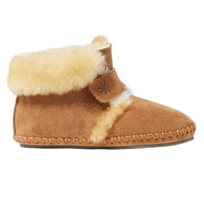 A toddler-size tan shearling slipper