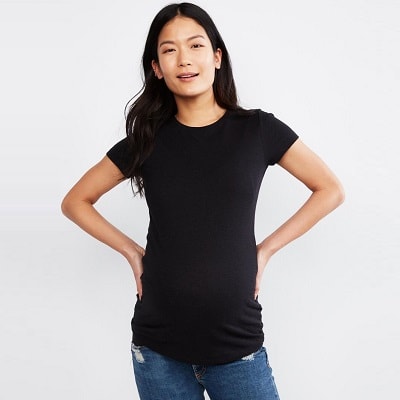 A woman wearing a Lightweight Maternity T-Shirt