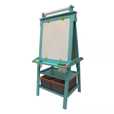 A turquoise child's easel with a shelf underneath it and two bins beneath that