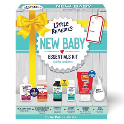 The packaging for a Little Remedies New Baby Essentials Kit. The box pictures six baby products and a yellow gift bow printed on it