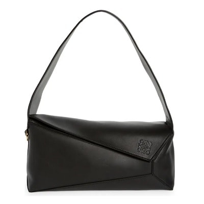 An asymmetrical, hobo-style black handbag