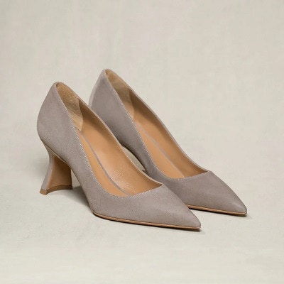 A pair of pointed-toe heels in taupe