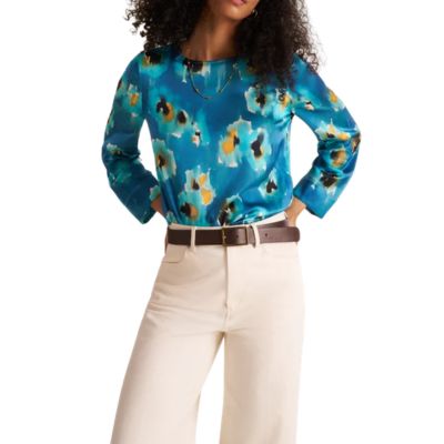 woman wears blue blouse with pattern