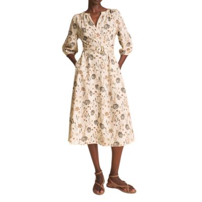 A woman wearing a floral dress