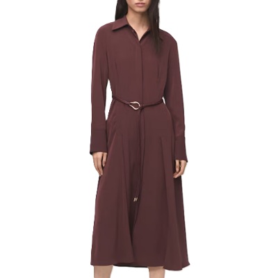A woman wearing a brown belted shirtdress