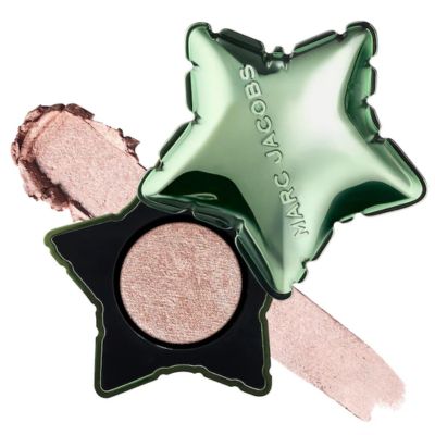 An open container of a Marc Jacobs Beauty eye shadow (green lid and black base), with a swatch of the metallic shadow