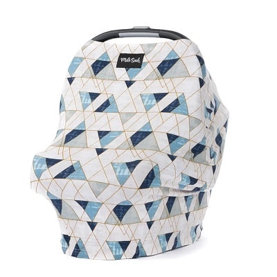 A geometric-print nursing/car seat cover on a car seat 