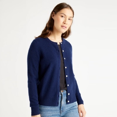 A lady wearing a navy blue cashmere cardigan