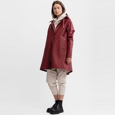 woman wearing stylish maroon raincoat